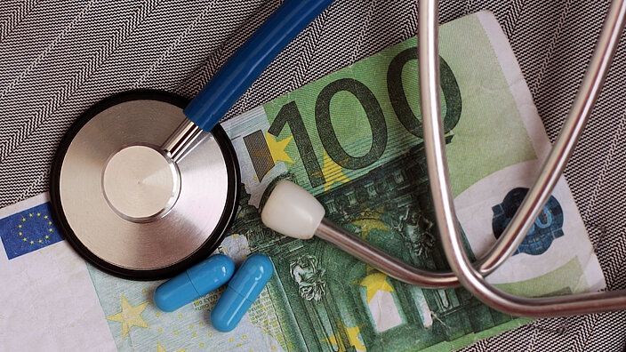 Stethoscope and Euro money, top view